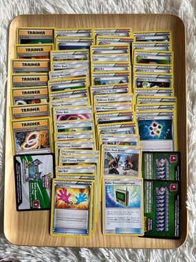 50 Pokemon Trainer Card Lot with Yellow Borders and Multicolor Artwork